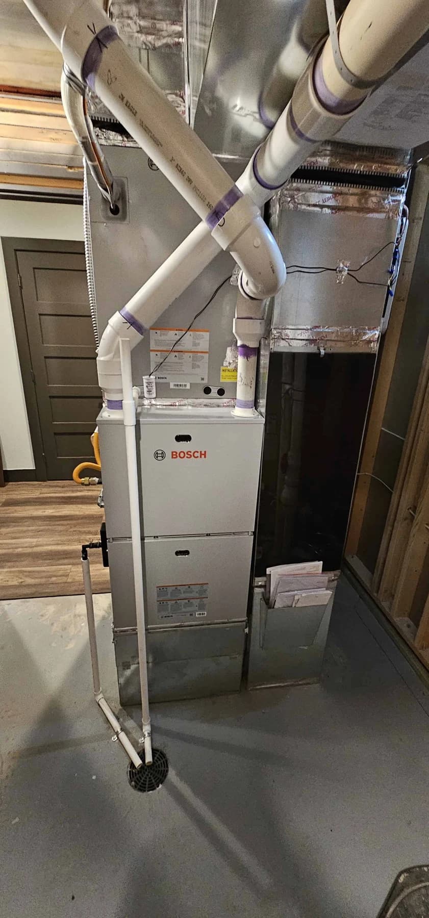 Gas furnace, indoor coil and connected ducts in an unfinished mechanical room